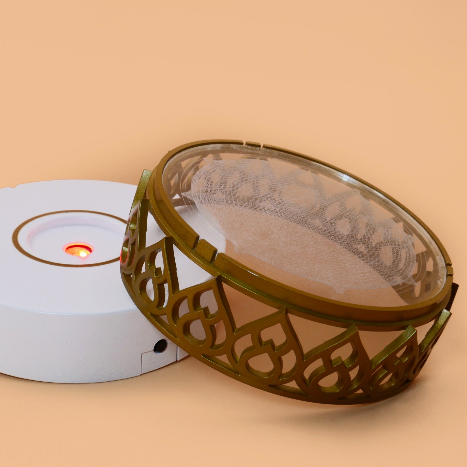 Chakra and Element Activator device with Silica Disk option on warm studio background